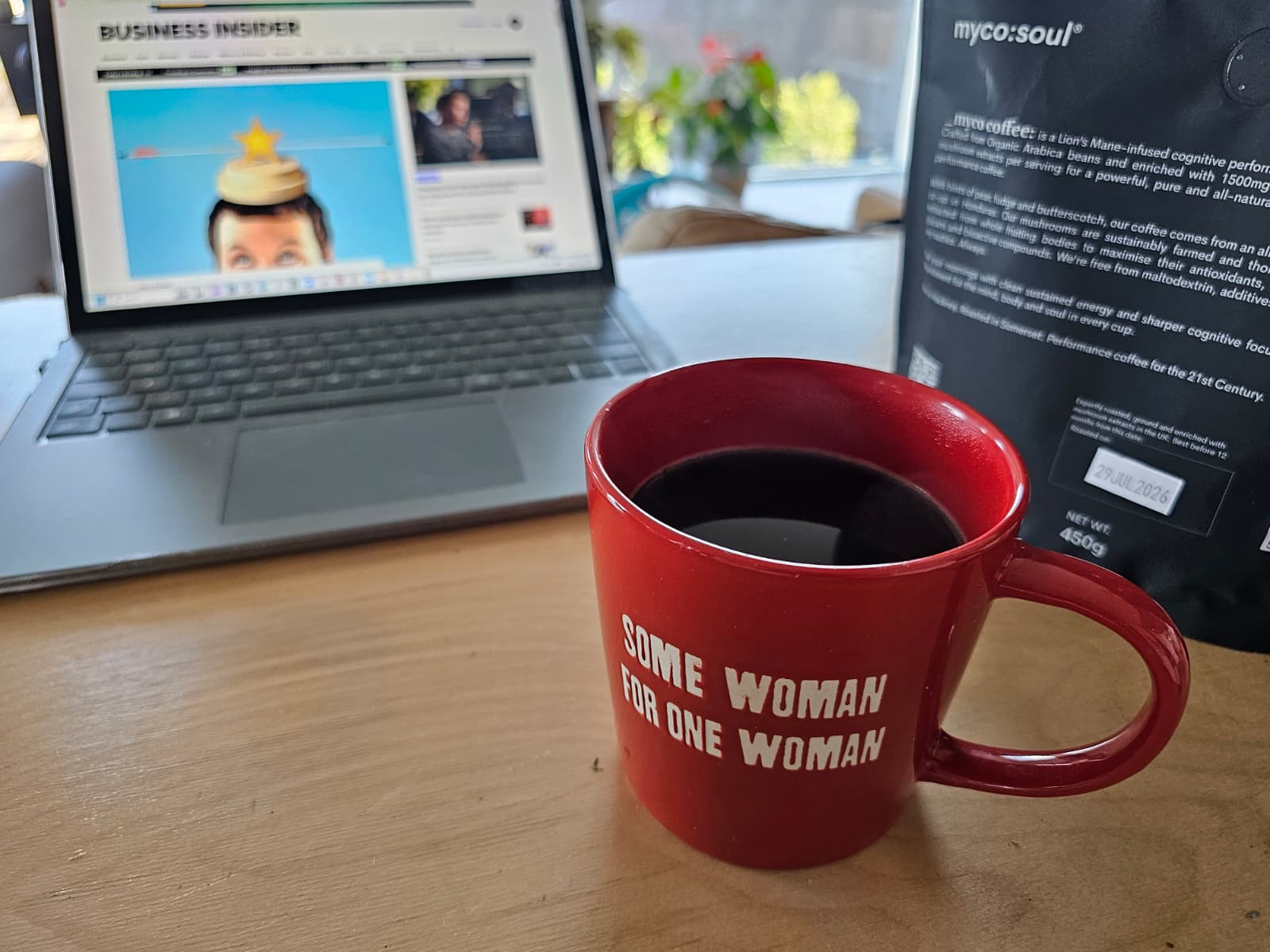 A brewed cup of myco:soul coffee on a desk